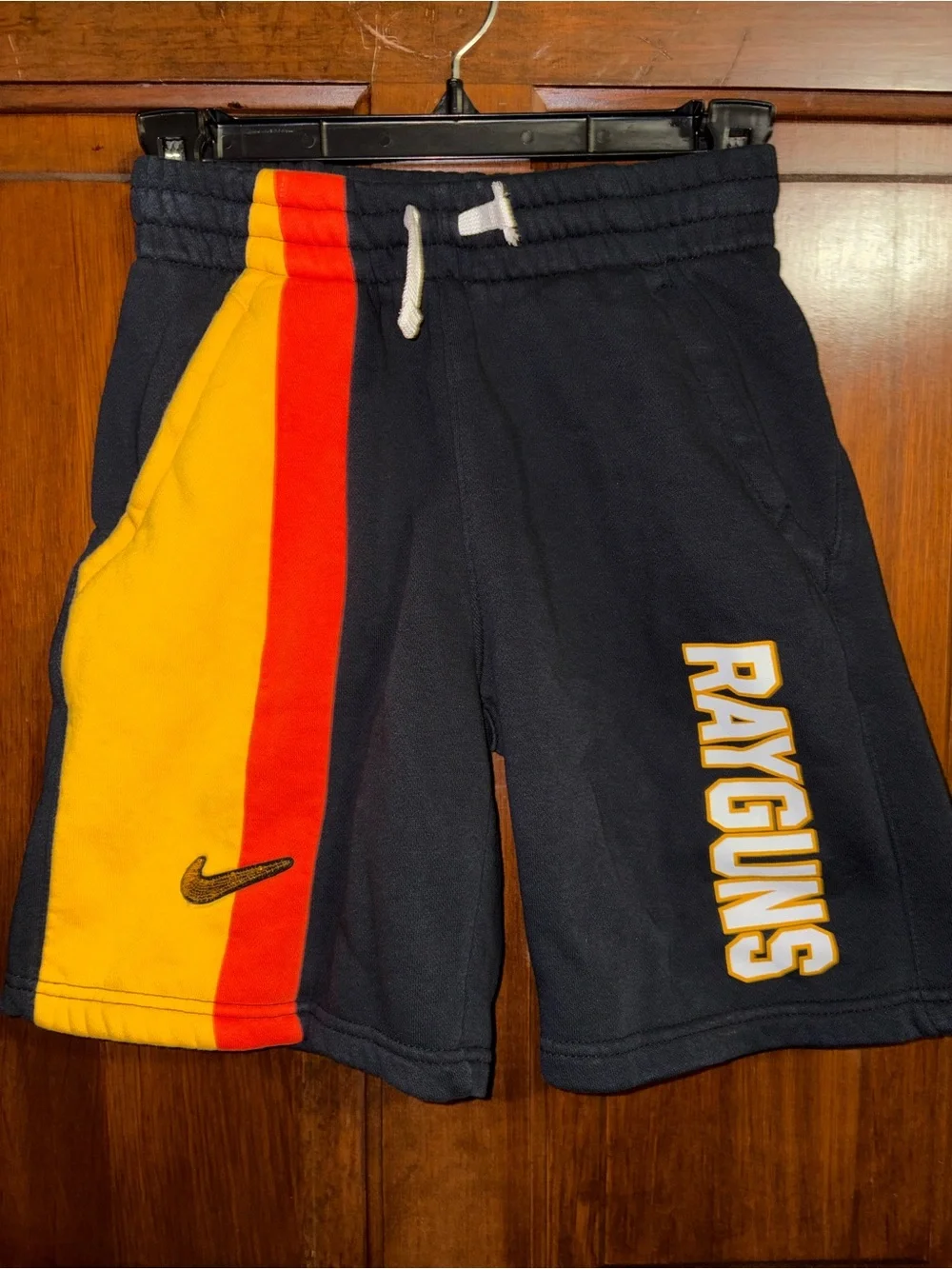 Nike Navy Shorts with Yellow and Red Side Stripes